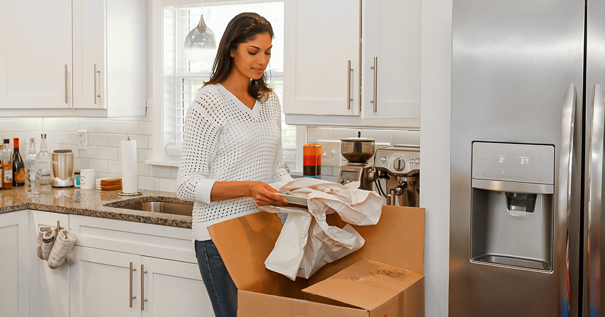 Zip Moving and Storage kitchen packing dishes.