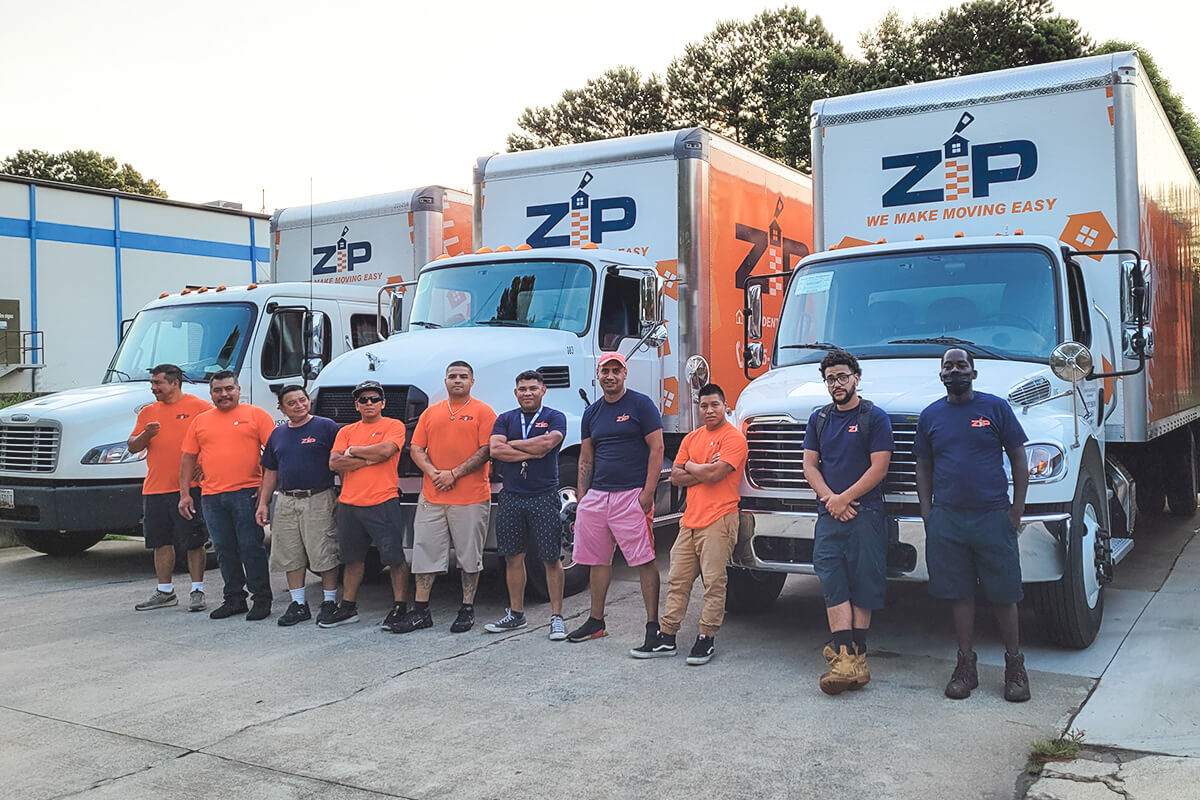 ZIP Movers in front of the trucks